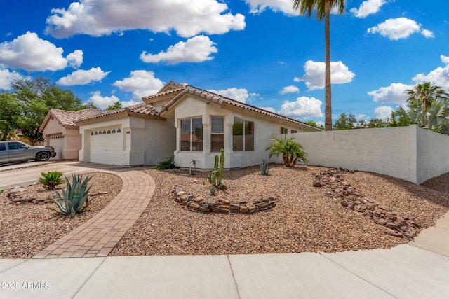1653 E Gail Dr, Chandler, AZ 85225 - view of front of property with stucco siding, a garage, driveway, and a tile roof
