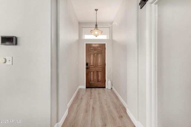 1653 E Gail Dr, Chandler, AZ 85225 - doorway to outside with light wood finished floors and baseboards