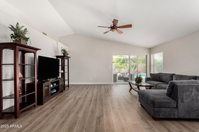 1653 E Gail Dr, Chandler, AZ 85225 - living area featuring ceiling fan, vaulted ceiling, light wood-style flooring, and baseboards