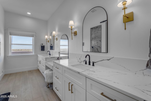 bathroom featuring vanity and wood-type flooring