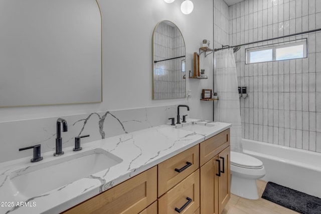 full bathroom featuring shower / tub combo with curtain, vanity, and toilet