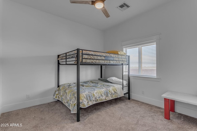 bedroom featuring ceiling fan and carpet