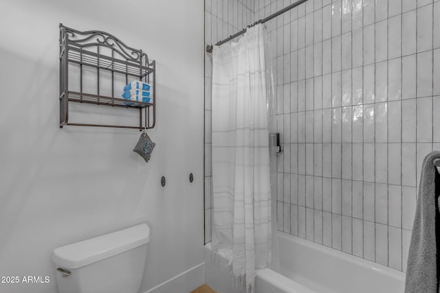 bathroom featuring toilet and shower / bath combo with shower curtain