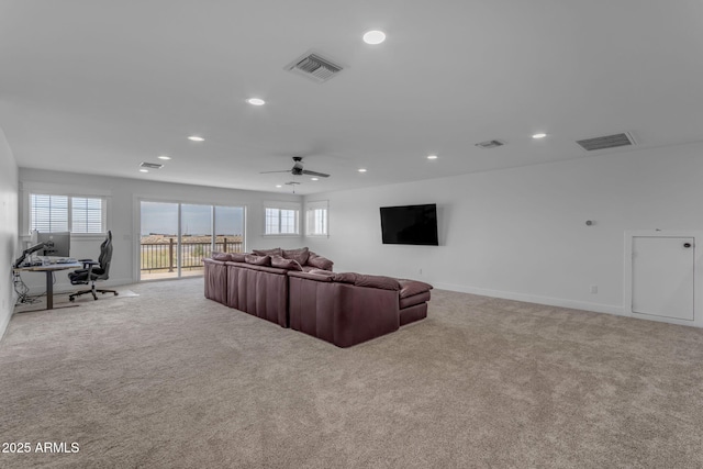 living room with light colored carpet and ceiling fan