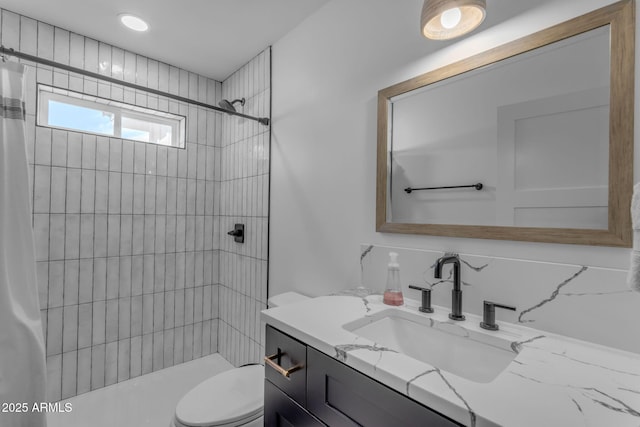 bathroom featuring a shower with curtain, vanity, and toilet