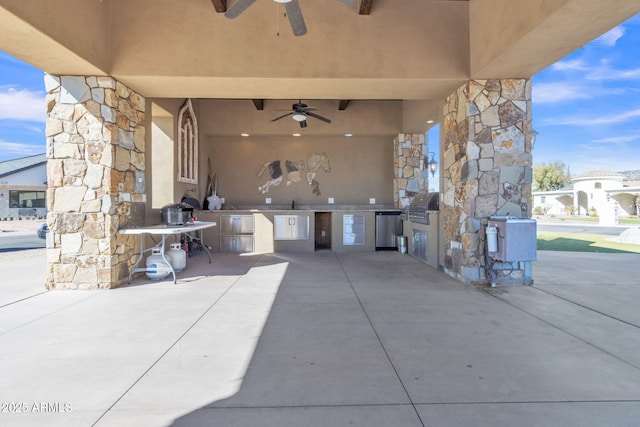 view of patio / terrace featuring exterior kitchen, area for grilling, sink, and ceiling fan