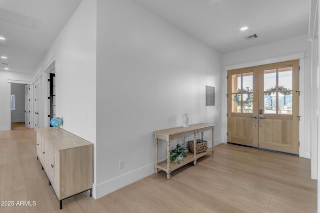 entryway featuring light hardwood / wood-style flooring and french doors