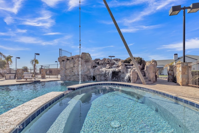 view of pool featuring pool water feature