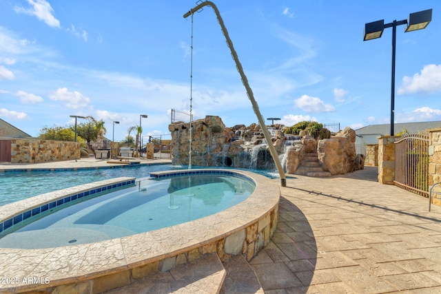 view of pool with pool water feature