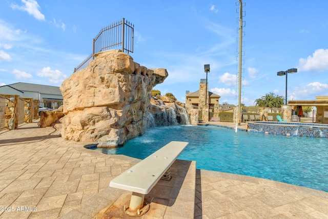 view of pool with pool water feature