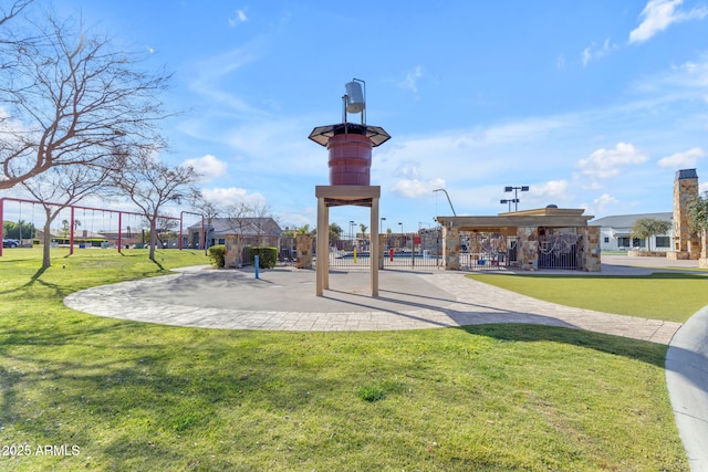 view of property's community with a yard and a playground