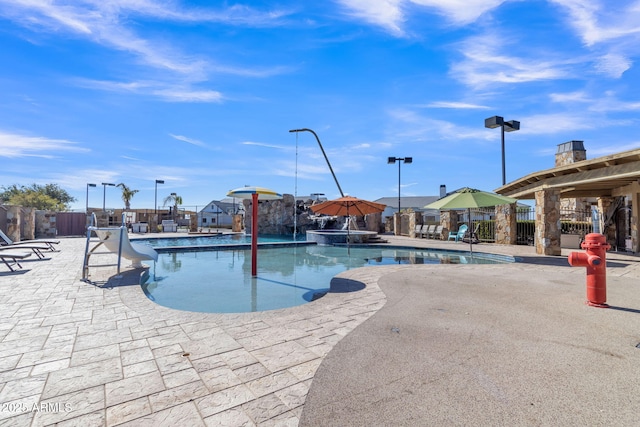 view of pool featuring a patio