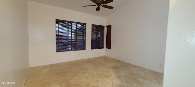 unfurnished room with light tile patterned floors and a ceiling fan