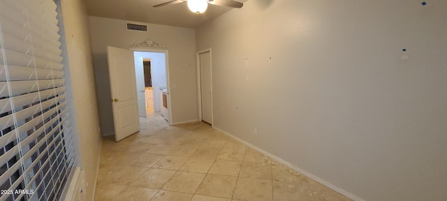 corridor with light tile patterned floors and visible vents