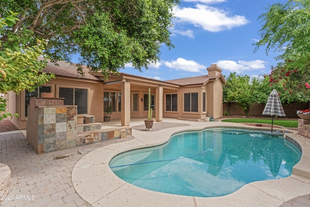 view of swimming pool with a fenced in pool, a patio area, and fence