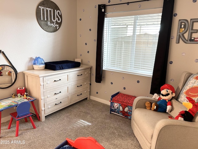 carpeted bedroom featuring baseboards