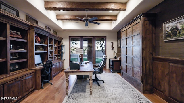 office with beam ceiling, ceiling fan, and light hardwood / wood-style floors