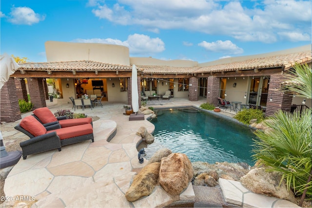 view of swimming pool with a patio