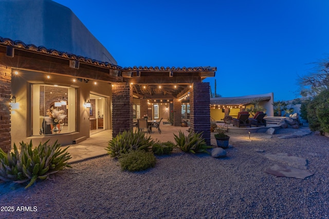 back of house featuring a patio