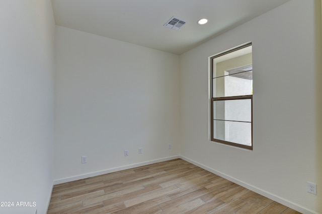 spare room featuring light hardwood / wood-style floors