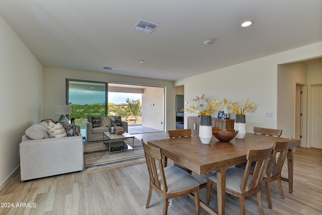 dining space with light wood-type flooring