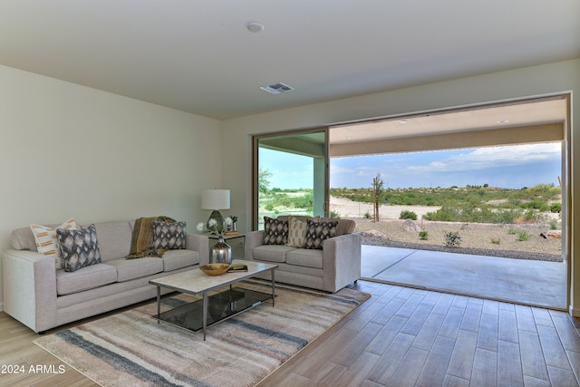 living room with light hardwood / wood-style flooring