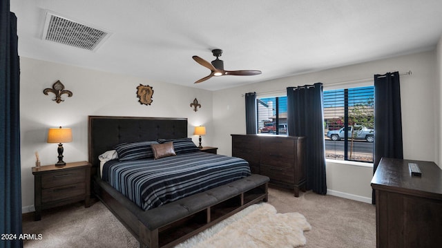 bedroom featuring ceiling fan and light carpet