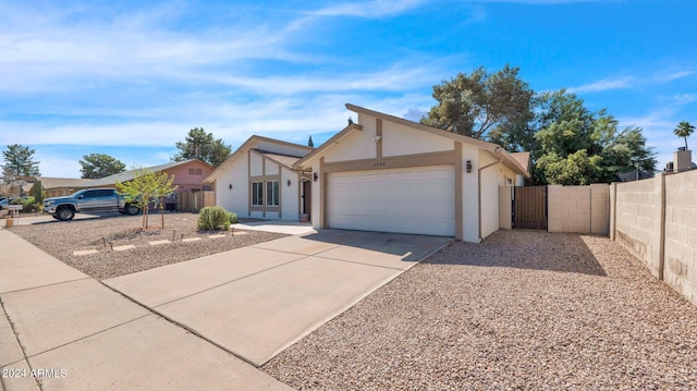 single story home featuring a garage