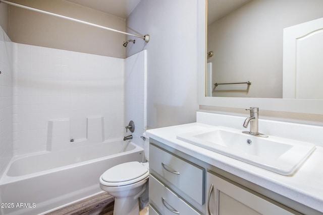 full bathroom featuring washtub / shower combination, vanity, toilet, and wood finished floors