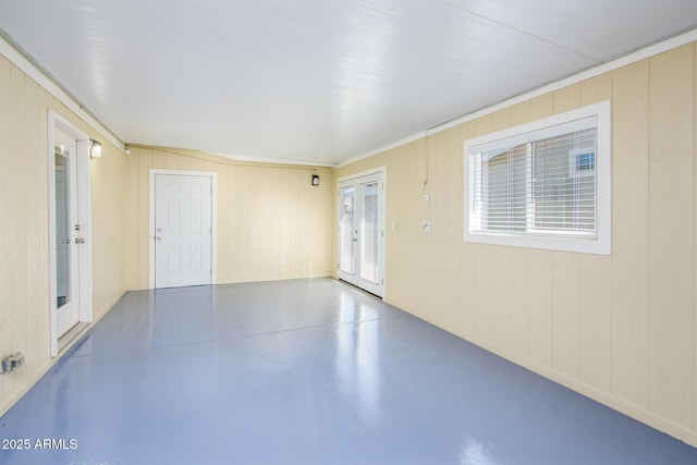 spare room with finished concrete floors and french doors