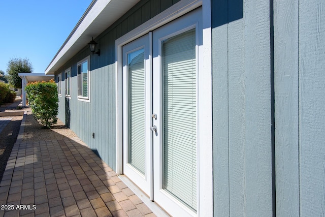 view of side of property with a patio