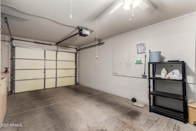 garage with a garage door opener, ceiling fan, and concrete block wall