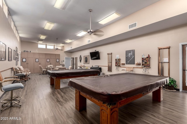 recreation room featuring ceiling fan, pool table, visible vents, a high ceiling, and wood finished floors