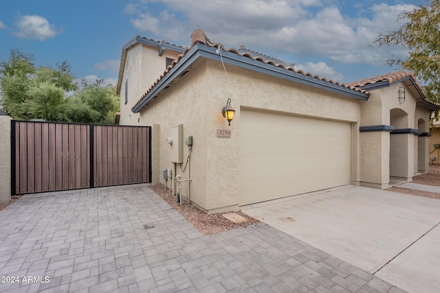 view of side of property featuring a garage