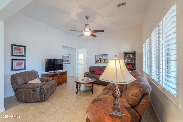 tiled living room featuring ceiling fan