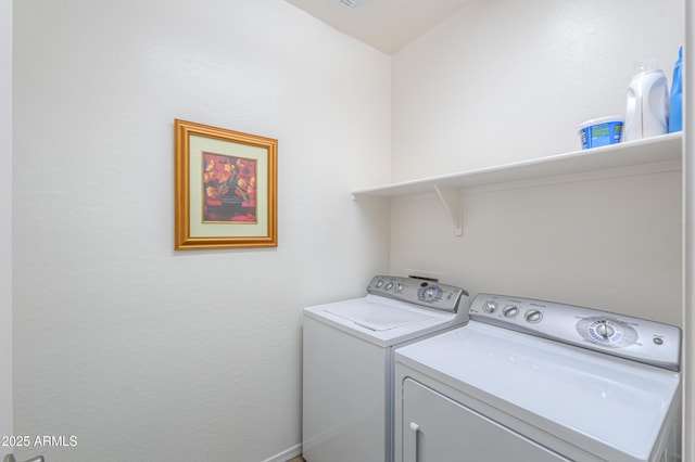 clothes washing area featuring washing machine and clothes dryer