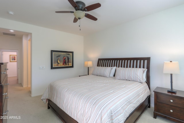 bedroom featuring ceiling fan and light carpet