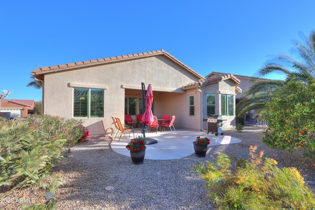 back of house with a patio area