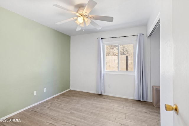 unfurnished room featuring ceiling fan and light hardwood / wood-style floors