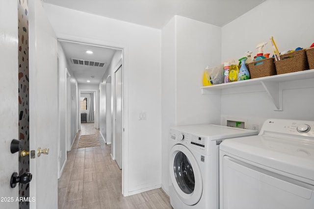 washroom with separate washer and dryer