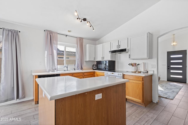 kitchen featuring white cabinetry, white electric range, decorative light fixtures, vaulted ceiling, and a kitchen island