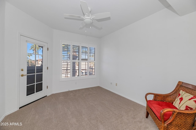 unfurnished room featuring ceiling fan and light colored carpet