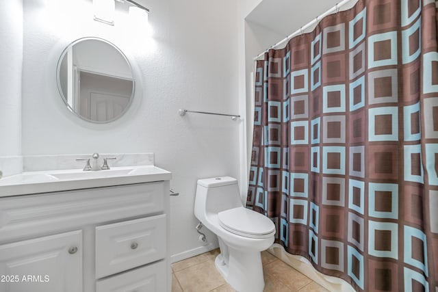 bathroom featuring tile patterned floors, vanity, toilet, and walk in shower