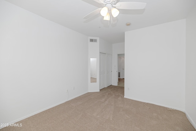 carpeted empty room with ceiling fan