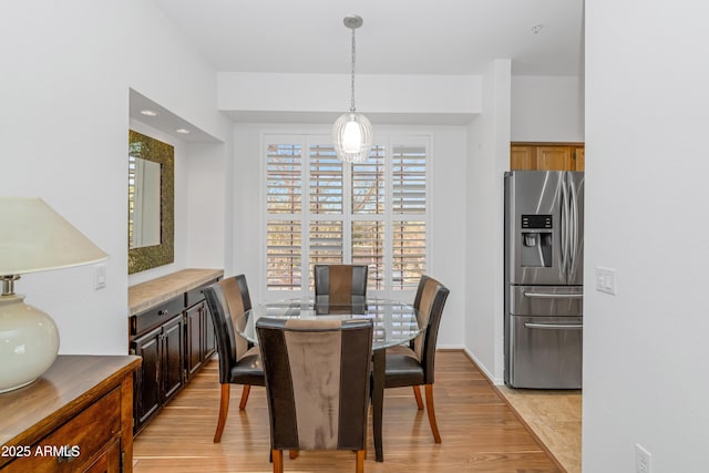 dining room with light hardwood / wood-style flooring