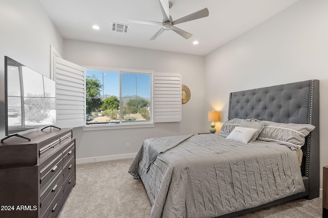 bedroom featuring ceiling fan and light carpet