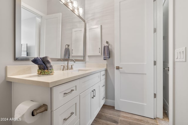 8523 N 192nd Ave, Waddell, AZ 85355 - bathroom featuring vanity, wood finished floors, and baseboards