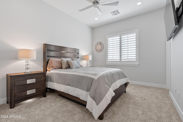 bedroom featuring light carpet and ceiling fan