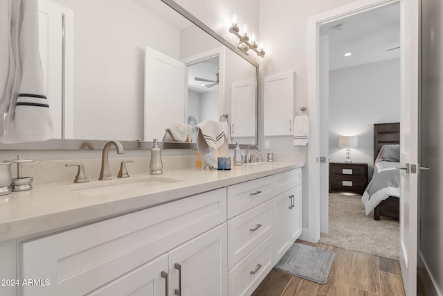 8523 N 192nd Ave, Waddell, AZ 85355 - ensuite bathroom with wood finished floors, double vanity, and recessed lighting