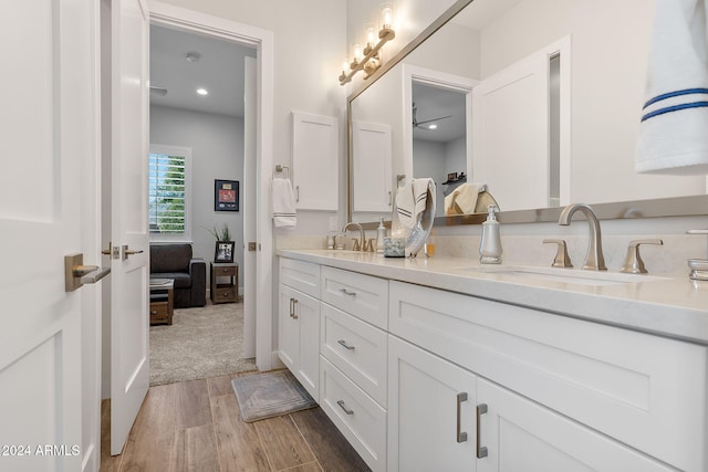 bathroom featuring hardwood / wood-style flooring and vanity